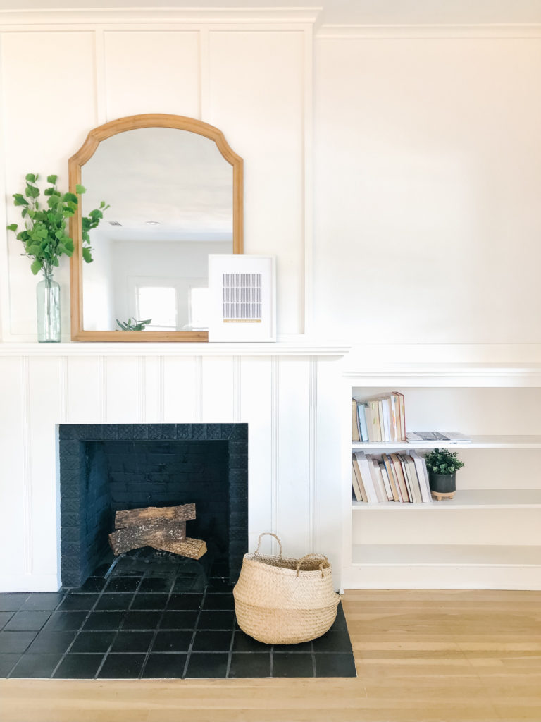 black and white fireplace shelves mantle brick | 102-year-old fixer upper house renovation | mid century modern Scandinavian home design | house flip reno